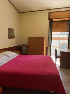 Postel nebo postele na pokoji v ubytování Hotel Apollo