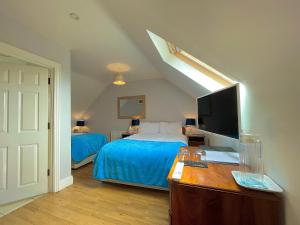 Katil atau katil-katil dalam bilik di Whitestrand B&B