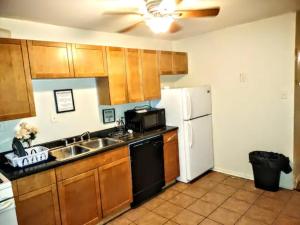 a kitchen with a sink and a white refrigerator at Room in Guest room - Cozy Bedroom close to downtown in Baltimore