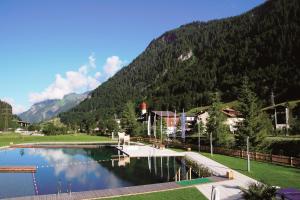 a view of a lake with a mountain in the background at Ferienwohnung Laura in Wald am Arlberg