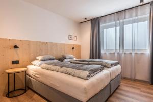 A bed or beds in a room at Apartement Franzl