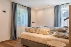 A bed or beds in a room at Apartement Franzl