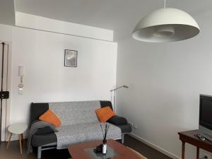 a living room with a couch and a table at Charming apartment in Principle Real in Lisbon