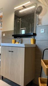 a kitchen with a sink and a counter top at Chalet l Écrin Vert in Plaine