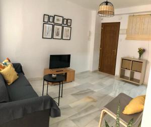 Televízia a/alebo spoločenská miestnosť v ubytovaní Apartamento en el Centro de Málaga