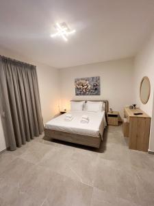 Postel nebo postele na pokoji v ubytování Clio Luxury Apartments