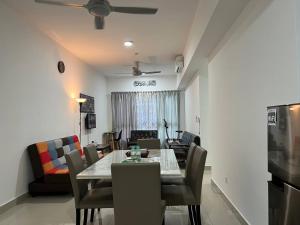 a dining room with a table and chairs at Dsistyle Islamic House in Kuala Lumpur