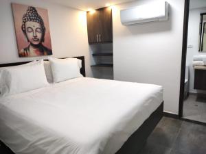 Postel nebo postele na pokoji v ubytování Hotel Qatar Cali