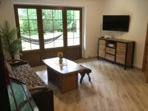 Televízia a/alebo spoločenská miestnosť v ubytovaní Ferienwohnung Avila , Stadtmitte Karpacz