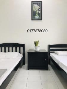 Кровать или кровати в номере Alyn Home Batu Pahat II Wifi Coway