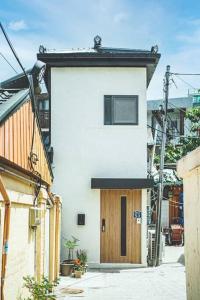a building with a wooden door on a street at Jongno Haru in Seoul