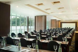 a conference room with tables and chairs and windows at Best Western Premier La Grande Bandung in Bandung +79 photos