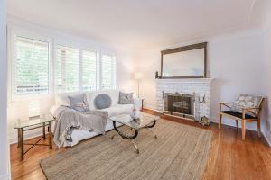 a living room with a couch and a fireplace at Luxury Detached 3 Bedroom Home in Burlington - The Renato in Burlington