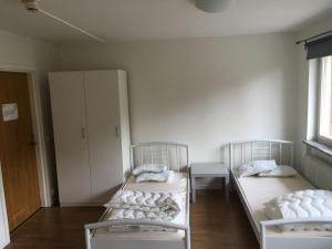 Säng eller sängar i ett rum på Hostel Svedjegården
