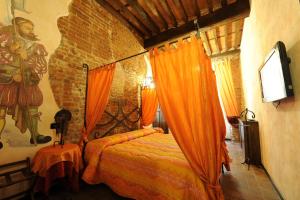 Postel nebo postele na pokoji v ubytování Antica Corte dei Principi charming rooms