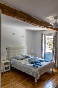Postel nebo postele na pokoji v ubytování Chambres d'Hôtes La Vigneronne + 37 fotografií