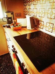 a kitchen with a counter with a stove top oven at The Best Place in the heart of Sofia City center in Sofia