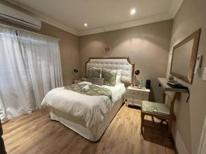 A bed or beds in a room at @Grace Guesthouse