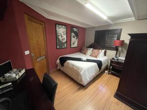 A bed or beds in a room at @Grace Guesthouse