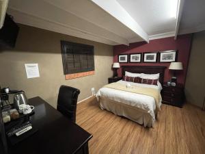 A bed or beds in a room at @Grace Guesthouse