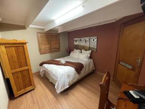 A bed or beds in a room at @Grace Guesthouse