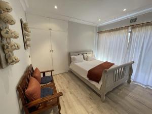 A bed or beds in a room at @Grace Guesthouse