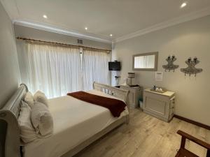 A bed or beds in a room at @Grace Guesthouse