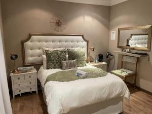 A bed or beds in a room at @Grace Guesthouse