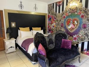 A bed or beds in a room at @Grace Guesthouse