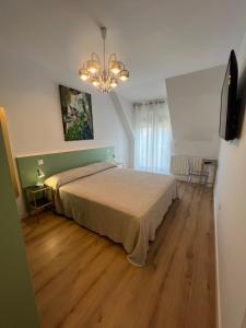 Posteľ alebo postele v izbe v ubytovaní Apartamento de Lujo a tan solo 4km de Santander.