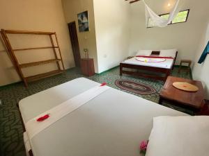 Letto o letti in una camera di Botanica Eco Lodge
