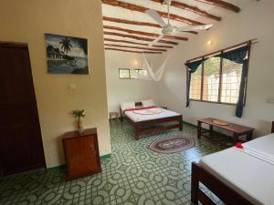 Letto o letti in una camera di Botanica Eco Lodge