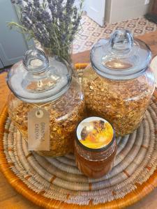 three jars of food on a tray on a table at Villa Alter in Alter do Chão