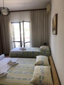 Postel nebo postele na pokoji v ubytování Castello Apartments