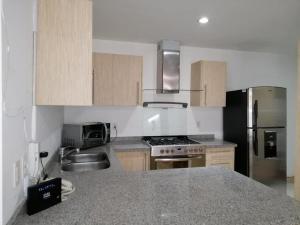 Nhà bếp/bếp nhỏ tại Nejapa Irrigación +60 ảnh