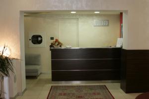 a large bathroom with a tub and a mirror at Alla Bianca Hotel in Marghera