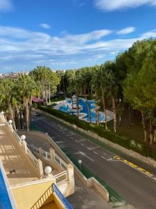 a view from the balcony of a resort with a swimming pool at Aquamarine home in Campoamor