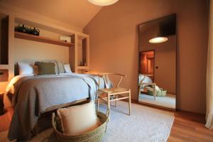 Ein Bett oder Betten in einem Zimmer der Unterkunft Vinha by NHôme