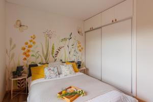 En eller flere senge i et værelse på Stylowe apartamenty