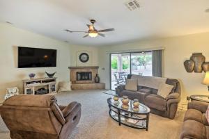 a living room with couches and a tv and a fireplace at Arizona Retreat with Casita about 2 Mi to Lake Havasu in Lake Havasu City