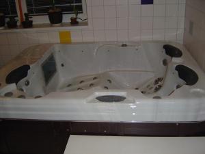 a white bath tub in a bathroom with at Vila Kamila in Janske Lazne +15 photos