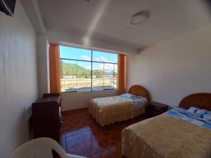 Postel nebo postele na pokoji v ubytování Hinkiori Inn - Hotel Manu + 3 fotografie