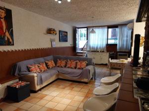 a living room with a couch and a table at Oasis Green Villa in Palermo
