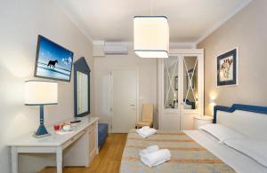 Postel nebo postele na pokoji v ubytování Hotel La Pace