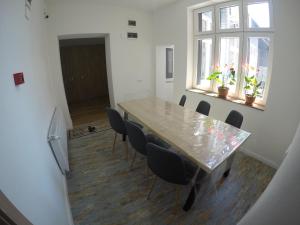 a dining room with a table and chairs at Casa Bacila in Sibiu