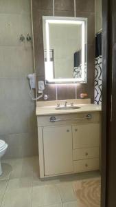 a bathroom with a sink and a mirror at Altos San Martín in Concepción del Uruguay