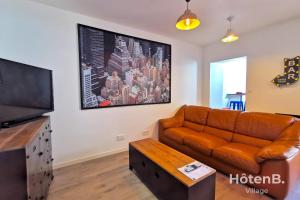 TV a/nebo společenská místnost v ubytování CLIM Jolie maison de 60 m2 avec jardin + 8 fotografií