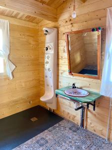 a bathroom with a sink and a mirror at Dos VILLAS ENTRE CIERVOS Y CERVANTES in El Cristo del Espíritu Santo