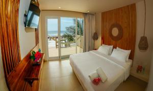 Ένα ή περισσότερα κρεβάτια σε δωμάτιο στο Hotel Kundalini