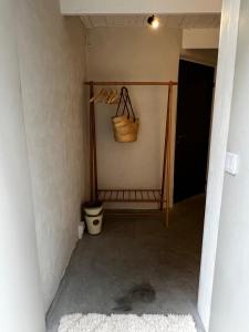 a hallway with a basket and a toilet in a room at Two Bedroom, Newly Renovated, Garden Apartment in Gärsnäs, Österlen in Gärsnäs